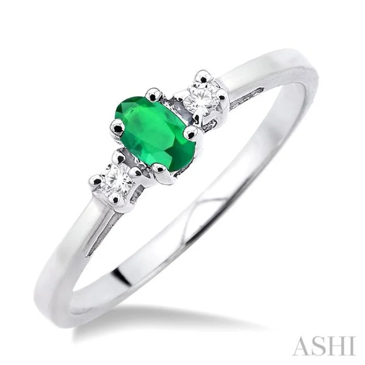 women’s bridal engagement rings-5x3mm Oval Cut Emerald and 1/20 Ctw Round Cut Diamond Ring in 10K White Gold